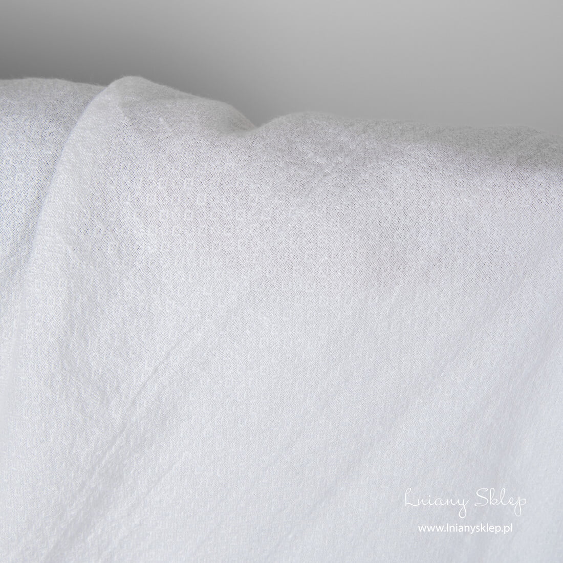 Śnieżnobiały len w romby. Dekatyzowana tkanina lniana.