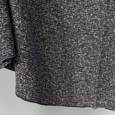 Tkanina prany czarno - szary melanż.