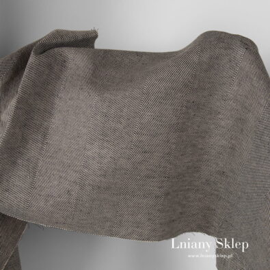 Tkanina w szary wzór jodełkowy.