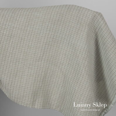 Zielonkawy prany len we wzorek.