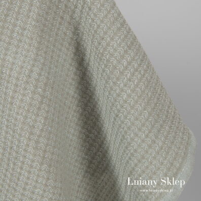 Zielonkawo szara tkanina wytkana splotem jodełkowym.