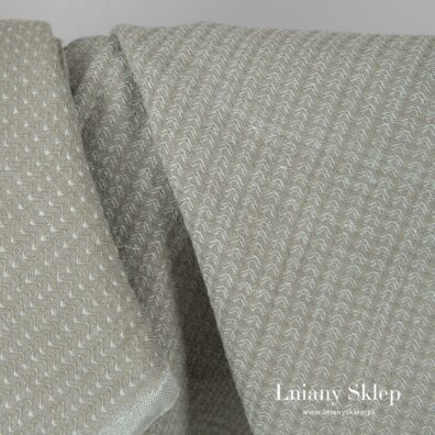 Zielonkawo szara tkanina wytkana splotem jodełkowym. w rysunek "listków".