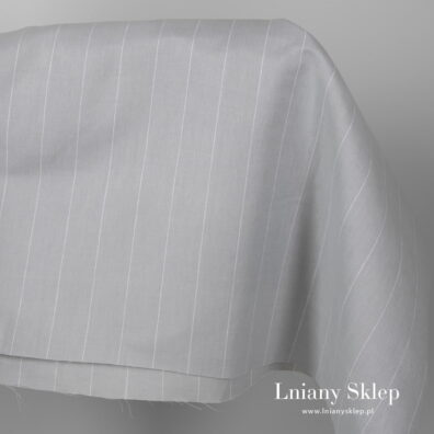 Szeroka szara jasna tkanina w paski.