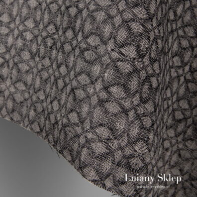 Tkanina w czarno - szary wzór geometryczny.