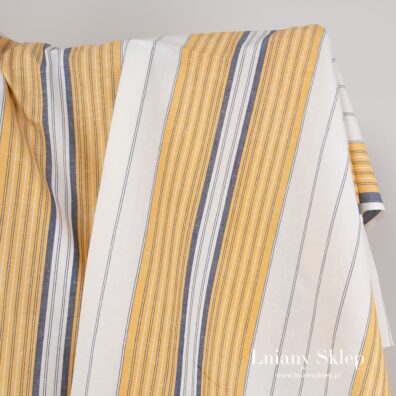 Biała tkanina w żółte i granatowe pasy.