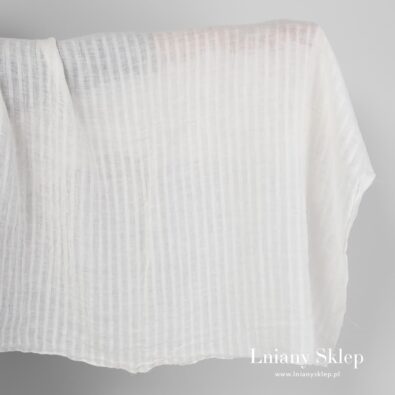 Biała tkanina lniana w ażurowe paski prana.