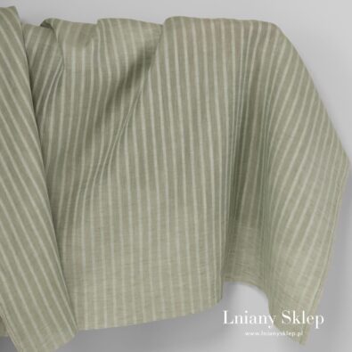 Zielona tkanina lniana w ażurowe paski.