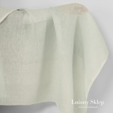 Lniana jasna pistacjowa przeźroczysta tkanina.