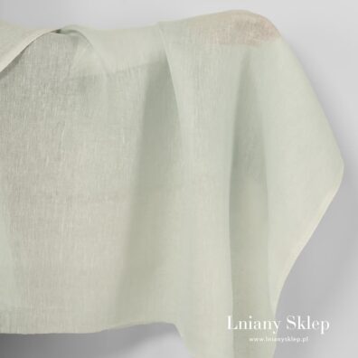 Lniana jasna pistacjowa przeźroczysta tkanina.