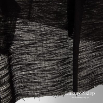 Przeźroczysta tkanina w prążki.