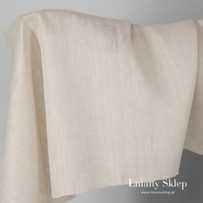 Tkanina lniana lekko piaskowa w wypukły wzorek.