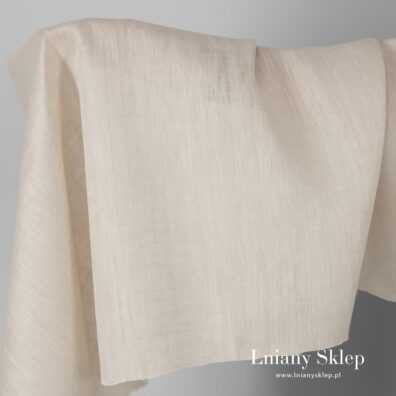 Tkanina lniana lekko piaskowa w wypukły wzorek.