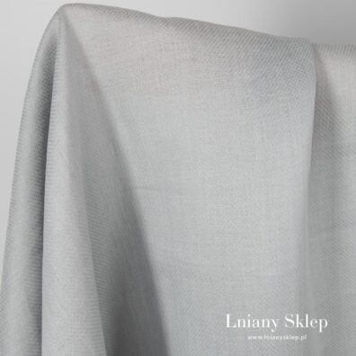 Jasny szary len w kwadraciki.