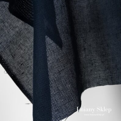 Ażurowa granatowa tkanina lniana.
