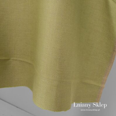 Jasnozielona w szare romby tkanina.