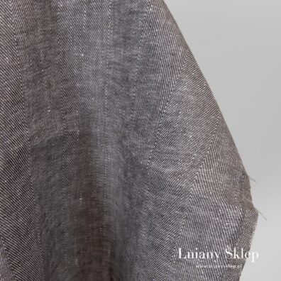 Szara tkanina lniana wytkana splotem jodełkowym.