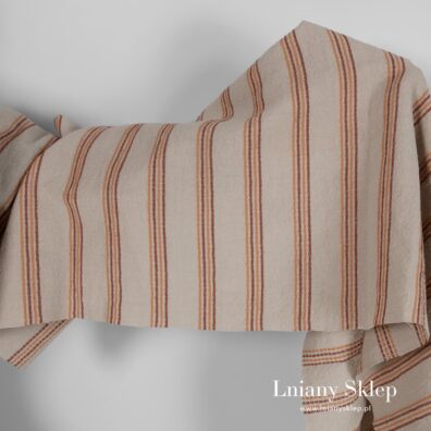 Szeroki piaskowy prany len w rude paski.