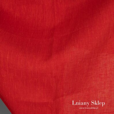Czerwono - pomarańczowa tkanina lniana.