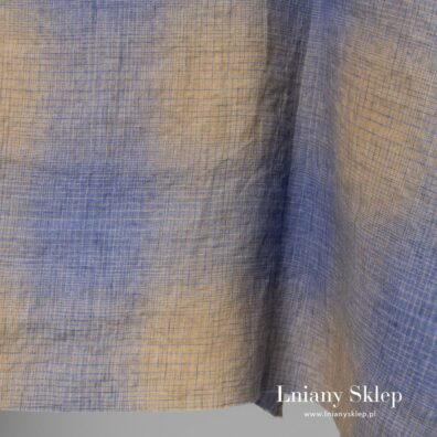 Tkanina wytkana w delikatną niebiesko - żółtą ktarkę.