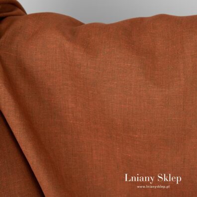 Tkanina lniana melanż pomarańczowej i brązowej przędzy.