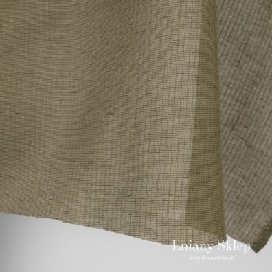 Zielona prześwitująca tkanina w paski.