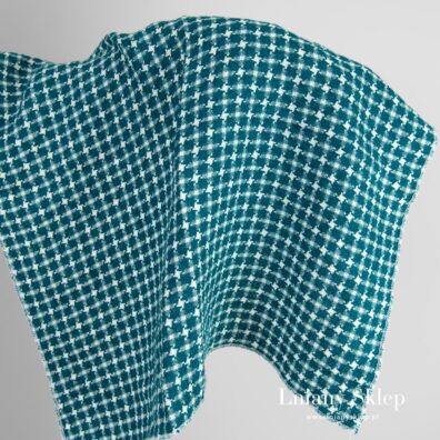 Biały z niebieskim prany len w pepitkę.