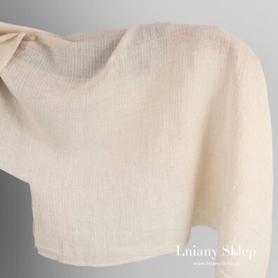 Jasny puder prześwitujący len z bawełną w paski.