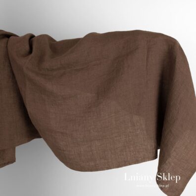 Zielona w fiolet tkanina lniana prana.