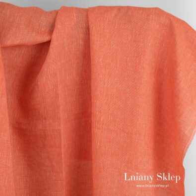 Tkanina lniana w melanżu czerwonym i jasnożółtym.