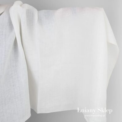 Biała tkanina lniana wytkana w ażurowe paski.