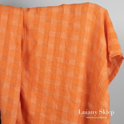 Przeźroczysty pomarańczowy prany len w kratkę.