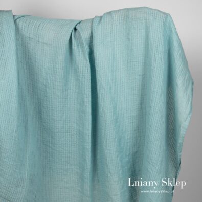 Zielonkawy w błękit prany len w przeźroczystą krateczkę .