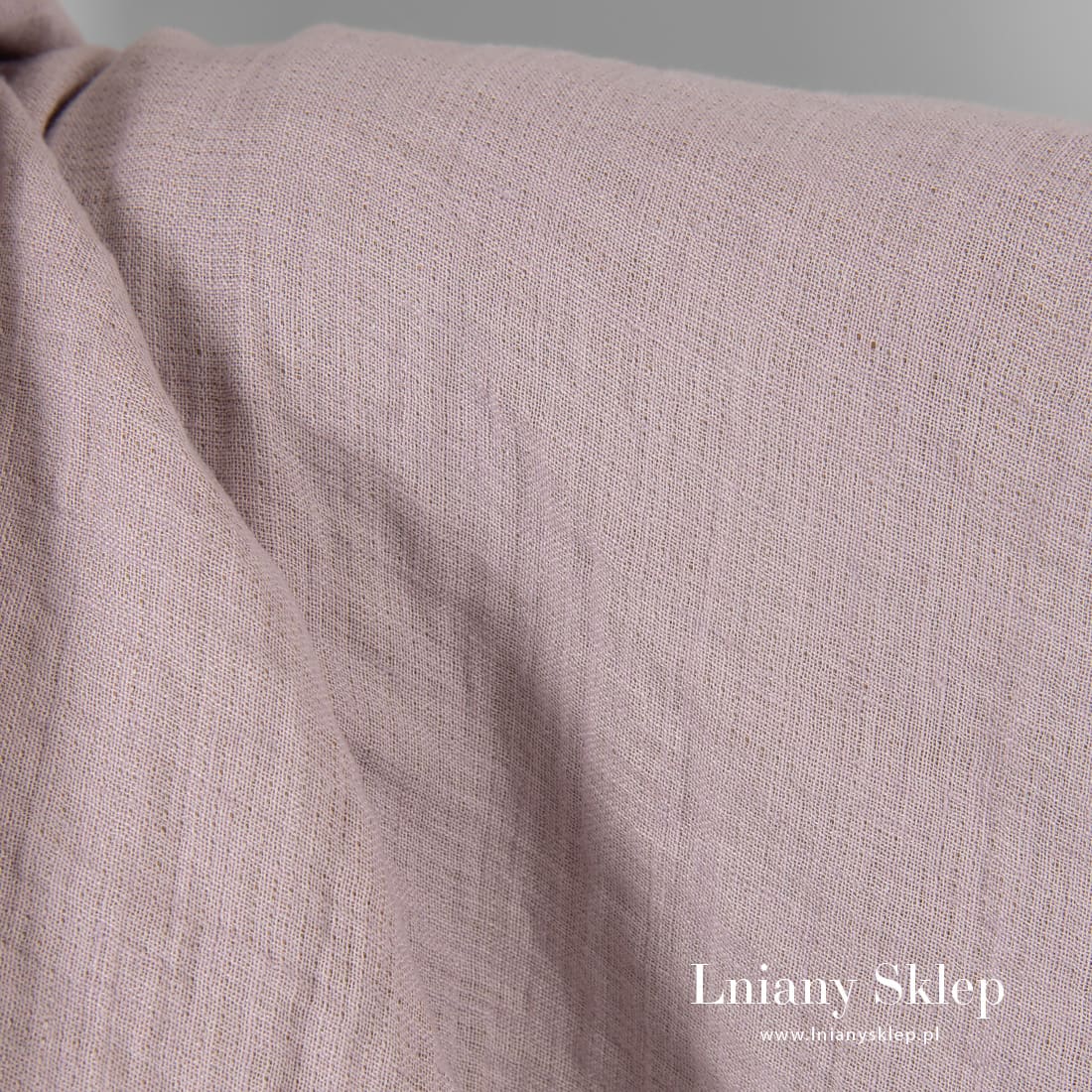 Liliowa prana tkanina lniana.