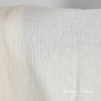 Ecru prany len wytkany w lekko wypukłą kratkę.