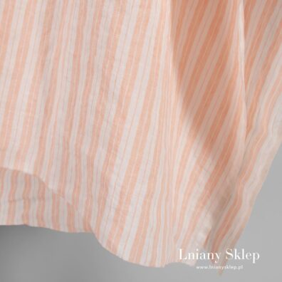 Biało - brzoskwiniowa prana tkanina lniana.