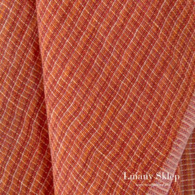 Tkanina wytkana w melanżu z kilku pomarańczowych, czerwonej, różowej i kremowej przędzy