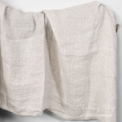 Jasny szary prany len splot jodełkowy.