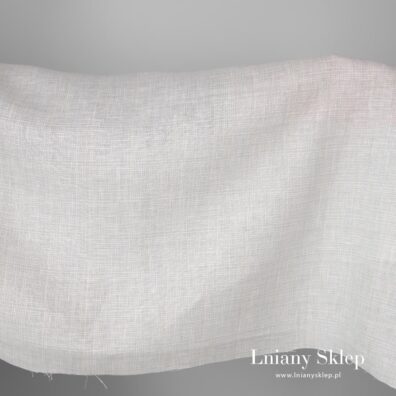 Szeroka tkanina lniana biała w szarość.