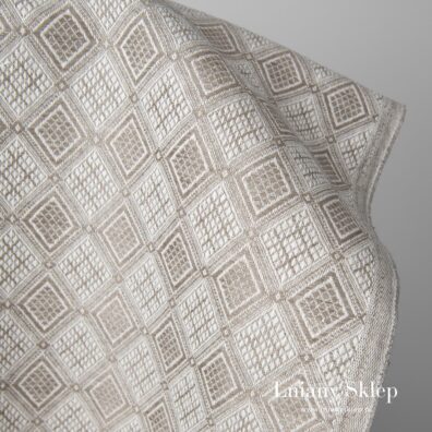 Piaskowa w romby żakardowa tkanina.