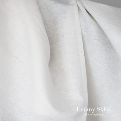 Białe tło wytkane w drobny wzorek.