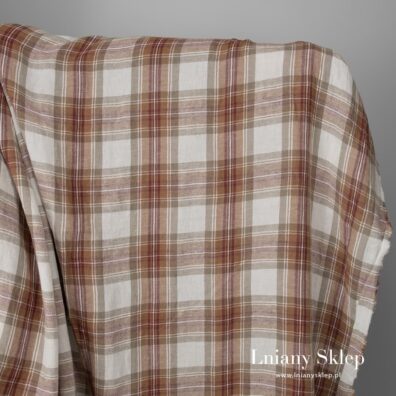 Szeroki len z bawełną prany w brązową kratkę.