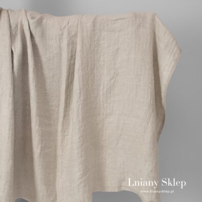 Len prany wytkany w jodełkę białą i piaskową.