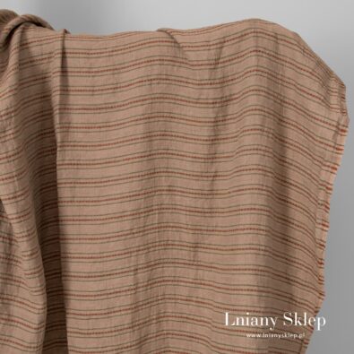 Piaskowa w paski prana tkanina lniana.