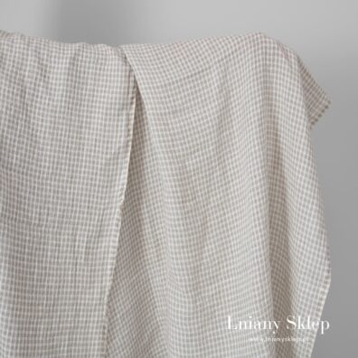 Niebarwiona w prześwitującą krateczkę tkanina lniana.