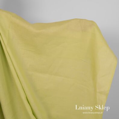 Jasnozielona tkanina lniana.