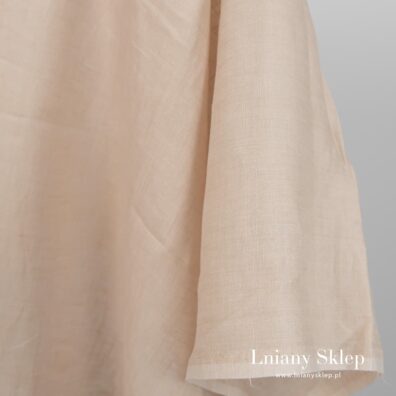 Lekka tkanina lniana. Żółtawy piasek.