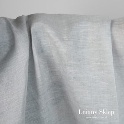 Tkanina wytkana z białej i kilku szarych przędz.