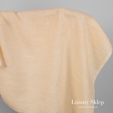 Żółtawa w prześwitujące paski tkanina lniana.