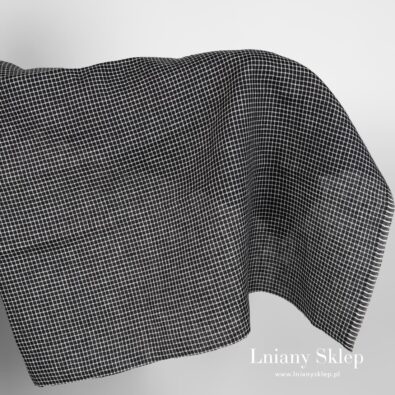 Czarna w białą krateczkę tkanina lniana.