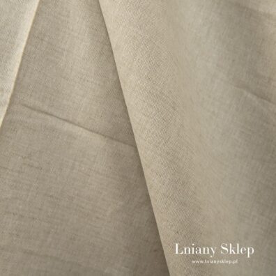 Piaskowa w zieleń tkanina lniano - bawełniana.